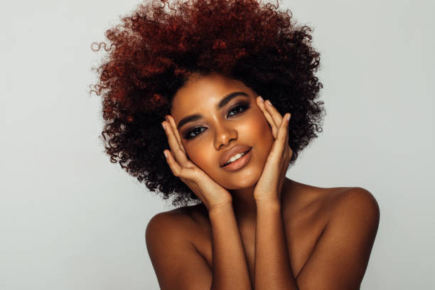 istock Beautiful afro woman with perfect make-up 1392610106