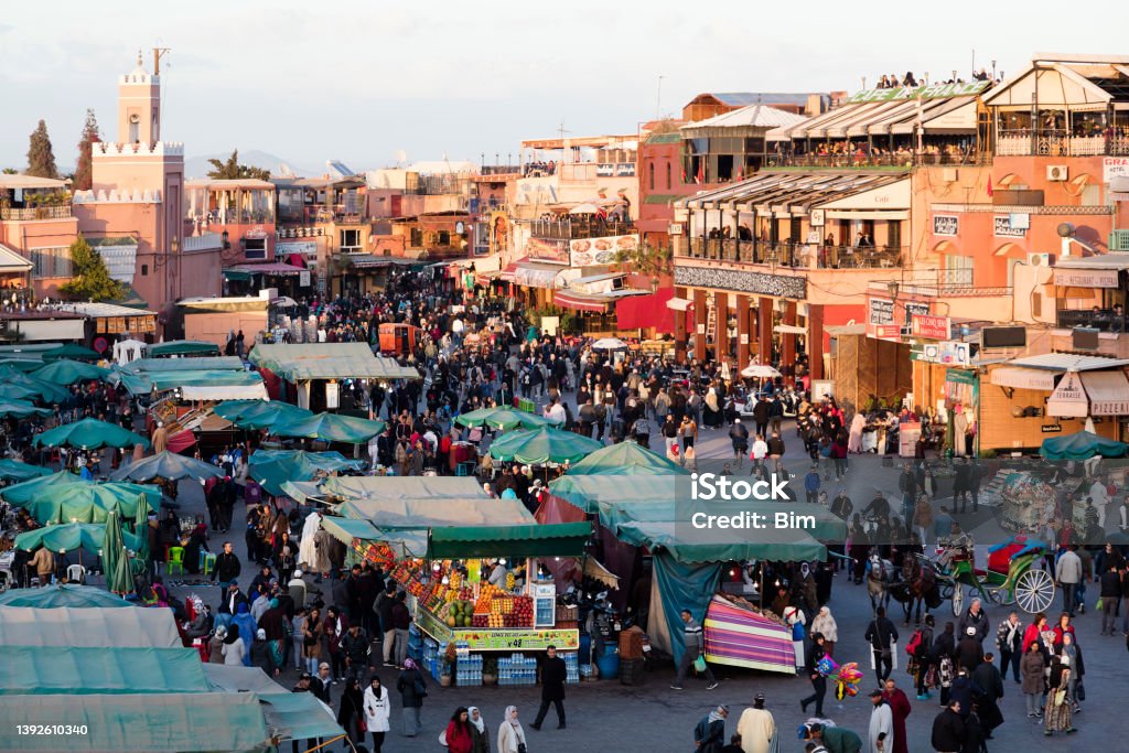 Djemaa El Fna Square in Marrakesh at Sunset, Morocco Djemaa El Fna square in Marrakesh at sunset, Morocco. Morocco Stock Photo