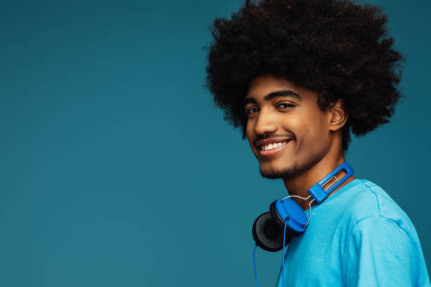 African american man with african hairstyle using phone stock photo