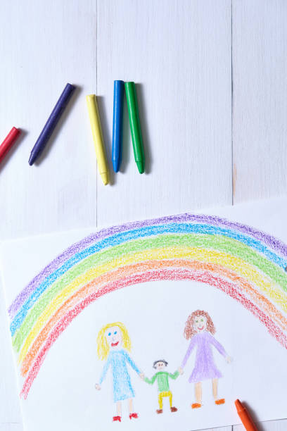 istock LGBT family picture on white table 1392611570