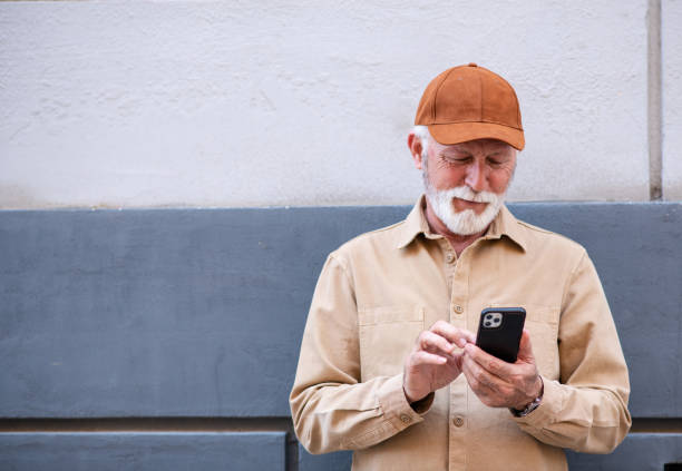 istock A senior man is dialing a phone number 1392612630