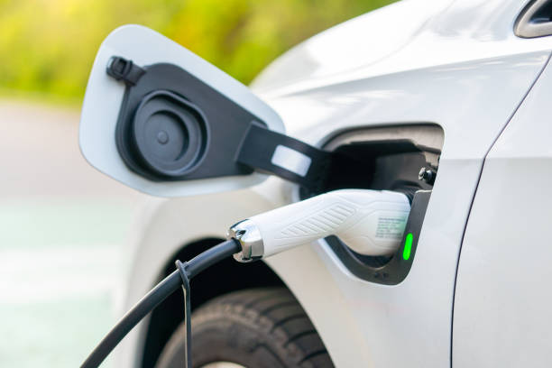 istock Electric Car Charging At Power Station 1392612679