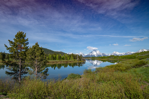 View from the east of the Oxbow Bend of the Snake River below the Teton peaks of the Grand Teton National Park near Jackson Hole, Wyoming in western United States of America (USA).