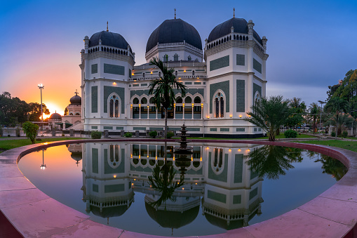 The grand mosque of medan with beautiful sunrise ay the background