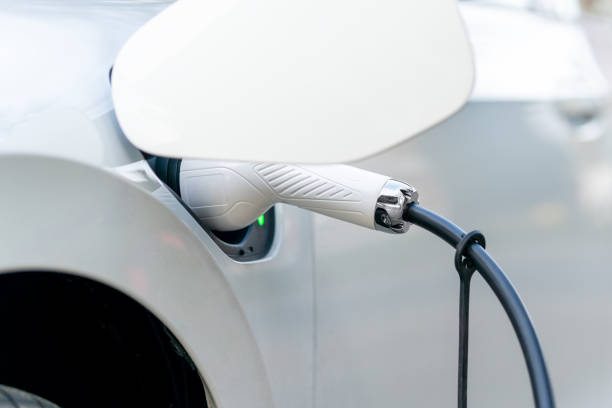 istock Electric Car Charging At Power Station 1392613715