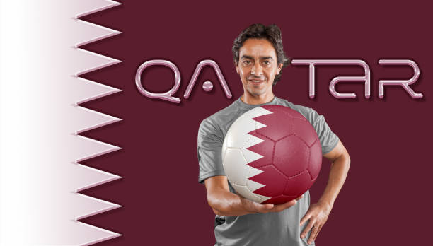 Qatar flag with player holding soccer ball