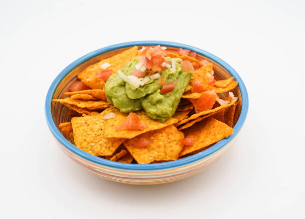 istock Nachos with cheese, meat, guacamole and tomato 1392613830