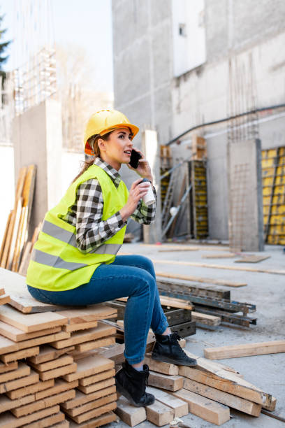 istock Female construction worker on a phone call 1392616868