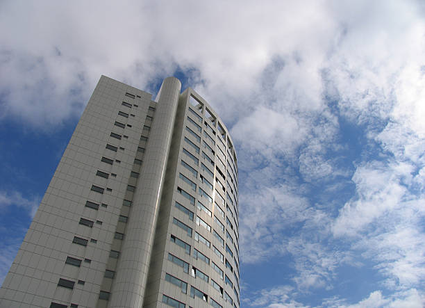 apartment building, cloudy sky stock photo