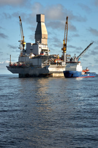 istock Oil rig offshore drilling platform and support vessel 1392621065