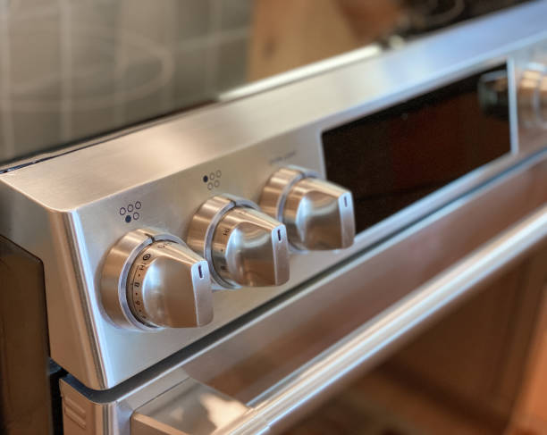 istock Knobs on convection oven. Close-up in kitchen. Modern. Cook top. 1392621249