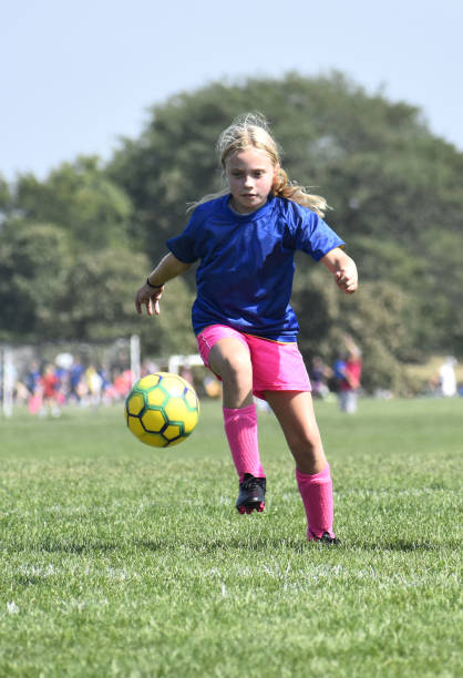 Girls Soccer: Kicked Ball stock photo