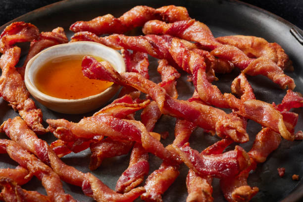 Spiraled  Thick Cut Bacon with Maple Syrup Sauce Spiraled  Thick Cut Bacon with Maple Syrup Sauce Made Famous on Social Media twisted bacon stock pictures, royalty-free photos & images
