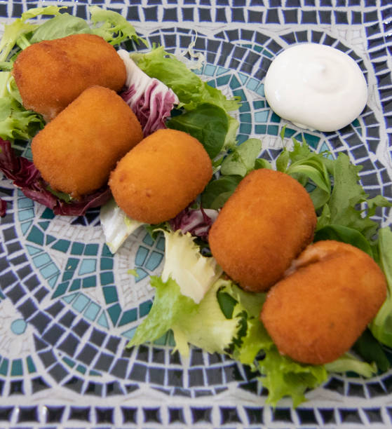 istock Prawn croquettes accompanied with salad 1392623555