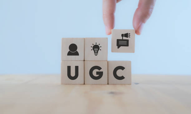 istock User-generated content concept.(UGC) Online marketing concept. Customer create content on social media . Close up hand put  wooden cube with 