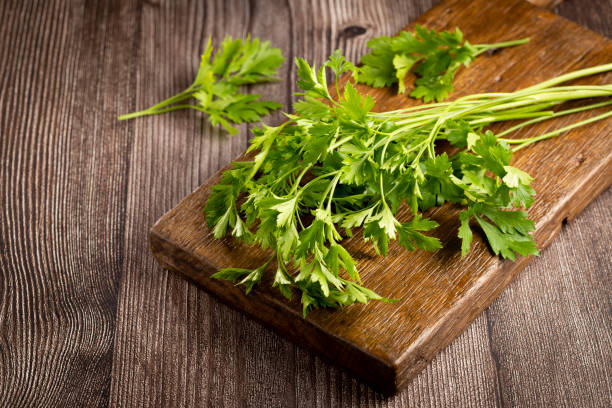 istock Fresh italian parsley on the table. Green parsley. 1392624520