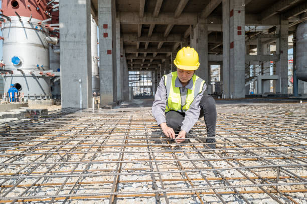 istock The female workers on the construction site are checking the steel bars 1392632946