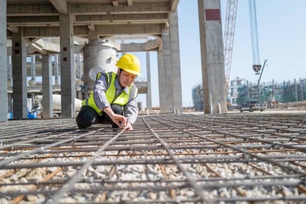 istock The female workers on the construction site are checking the steel bars 1392632947