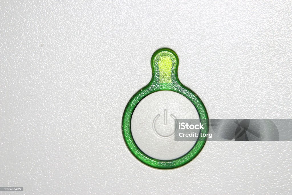 Green Power Button A larger green power button off of a monitor. Great detail, in series with the red button Circle Stock Photo