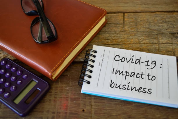 istock Notebook written with text COVID-19: IMPACT TO BUSINESS. 1392636080