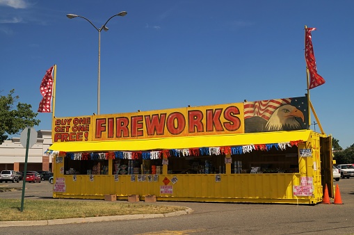 Arlington, Virginia  - July 7, 2018: A pop-up fireworks stand in a shopping mall parking lot
