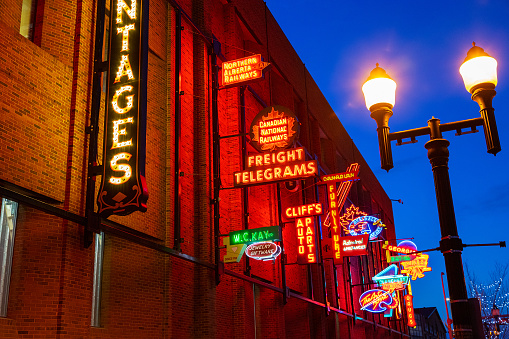 Free outdoor public Neon Sign Museum is a collection of historic neon signs from old or demolished buildings and brought back to life for display on the 4th Street Promenade in downtown Edmonton, Alberta, Canada.