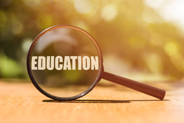 istock EDUCATION text written through a magnifying glass. Business education concept. 1392637381