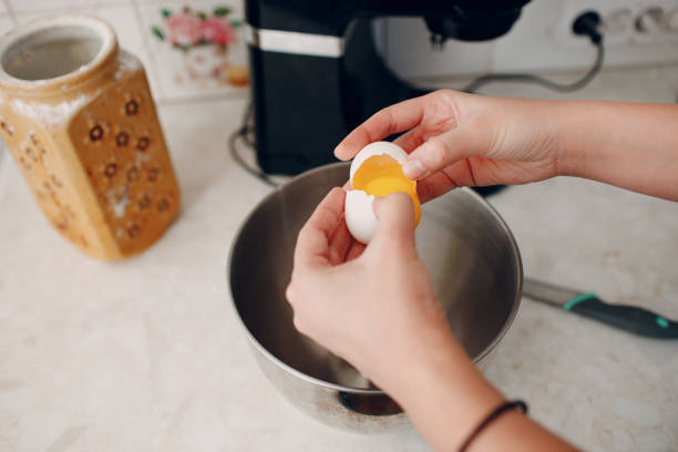 istock Pastry chef makes cake. Cooking and beat eggs 1392637663