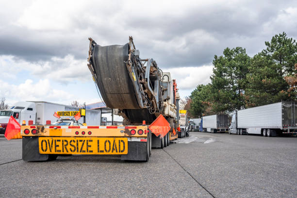 an oversize load truck is parked in a parking lot