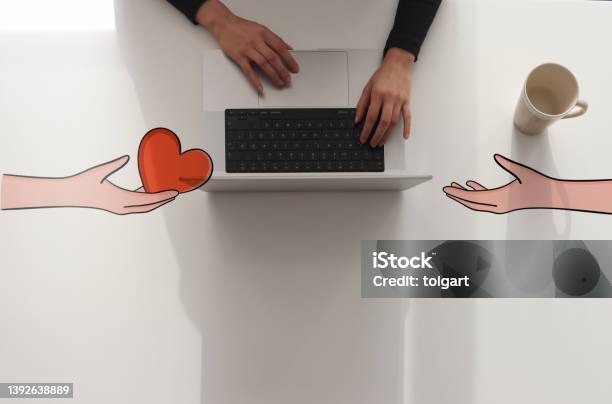 Woman Using Laptop With Non Profit Organization Concept Stock Photo - Download Image Now