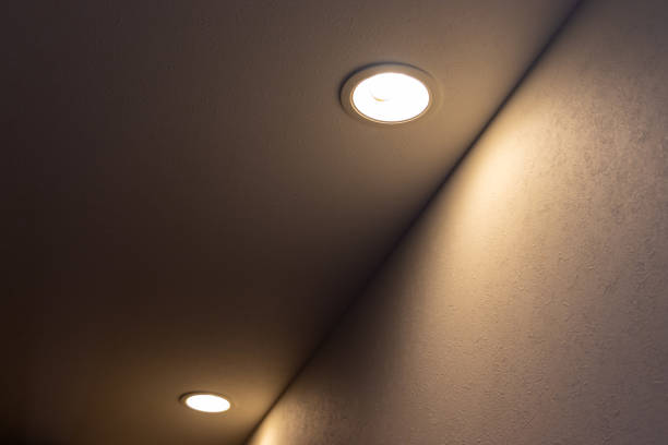 istock Ceiling downlights that illuminate the wall of the aisle 1392640567
