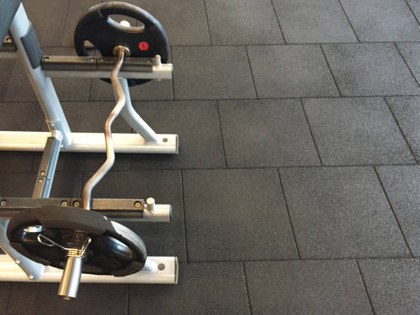 istock Barbell and rubber floor in the gym 1392640765