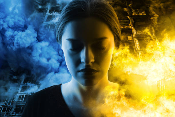 Woman's portrait on fire destroyed buildings background. War in Ukraine