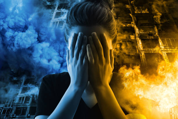 istock Woman's portrait on fire destroyed buildings background. War in Ukraine 1392653364
