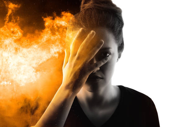 istock Woman's silhouette portrait on fire and white background. War in Ukraine 1392653412