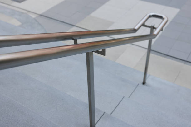 istock stainless handrail on stone stair steep. outdoor handrail. 1392653726