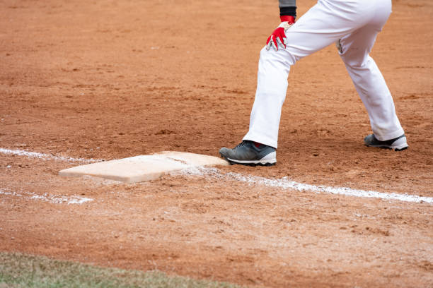 istock player standing on a baseball field 1392655373