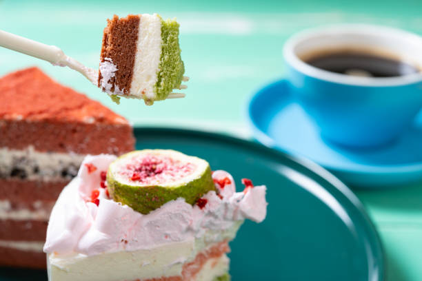 eating sweet cakes and cup of coffee horizontal composition