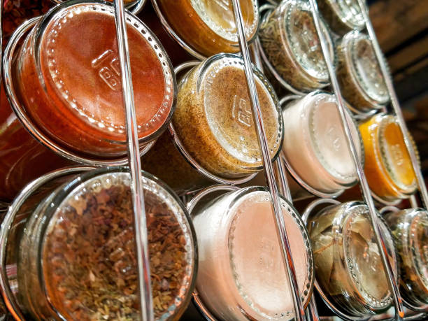 Spice Rack Back Close-up Close-up photo of a spice rack with various spices. spice rack stock pictures, royalty-free photos & images