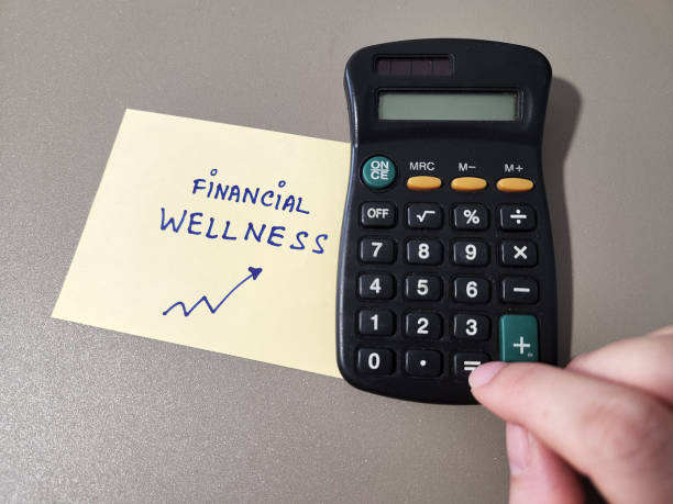 istock Financial wellness concept using calculator and a note with the words 