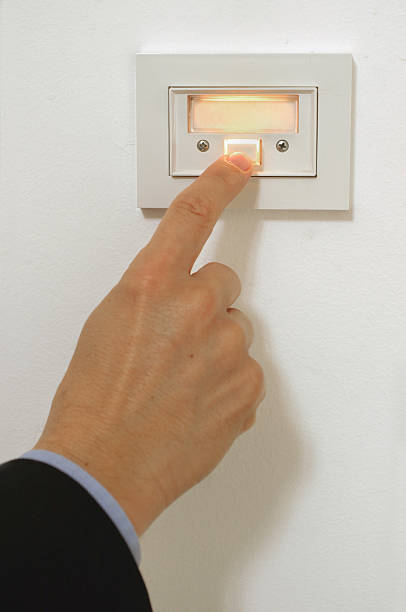 istock A man In a suit pressing a door bell 139265690
