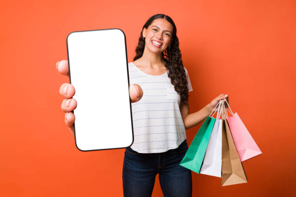 istock Cheerful woman using a shopping app 1392657144