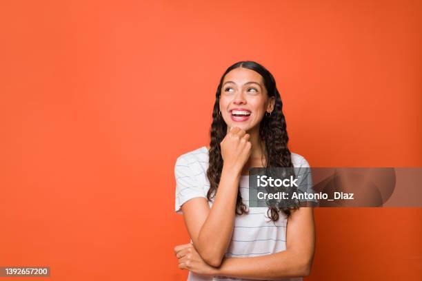 Smiling Woman Dreaming About The Future Stock Photo - Download Image Now - Looking Up, Portrait, Contemplation