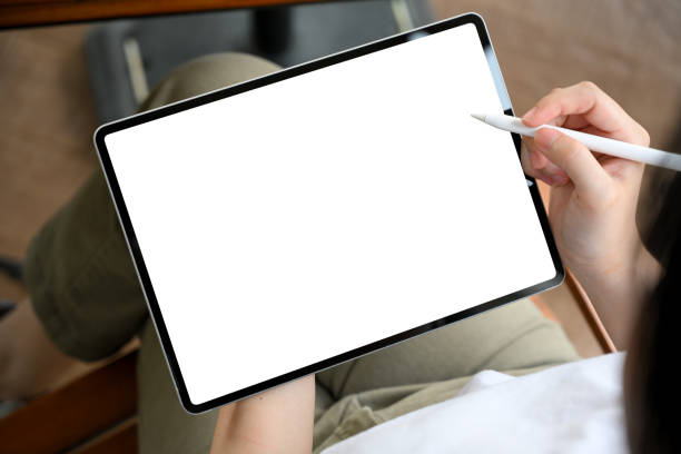 istock Female designing her graphic adds banner on digital tablet. 1392662684