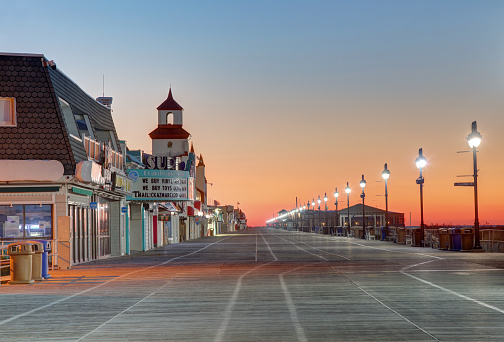Ocean City, New Jersey, USA - April 4, 2022: Morning view of the 3 mile long boardwalk lined with hotels, restaurants, bars, shops and amusements.