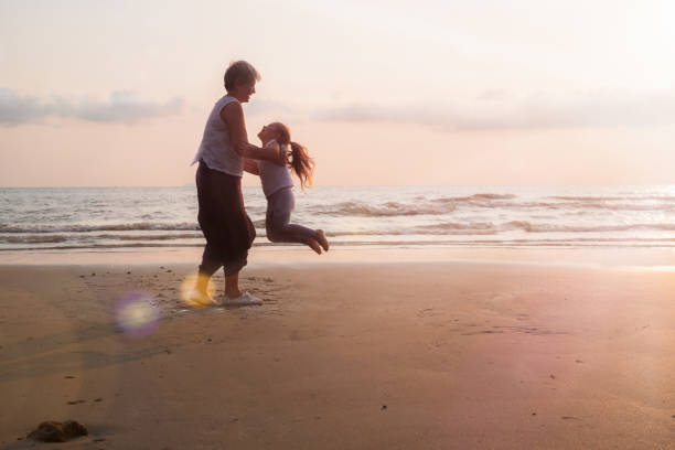 istock Senior and child on the beach 1392663745