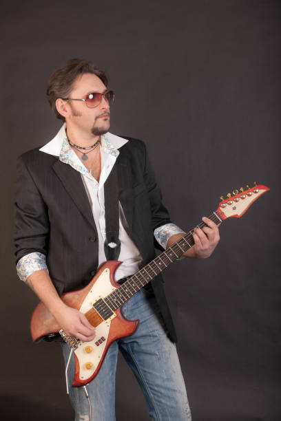 istock man playing electric guitar 1392667132