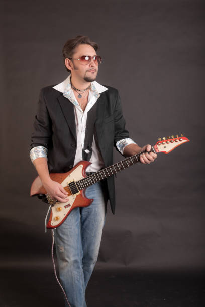 istock man playing electric guitar 1392667139