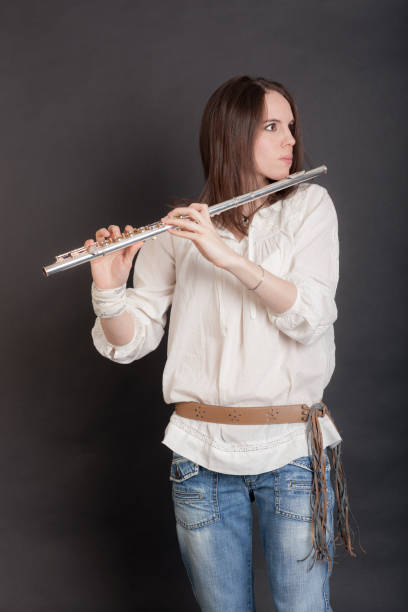 istock woman with flute 1392667144