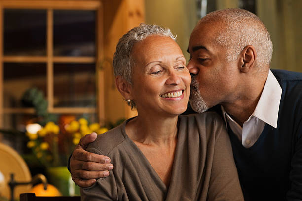Mature couple kissing  falling in love photos stock pictures, royalty-free photos & images